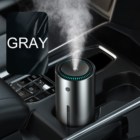 Dark gray cylindrical vehicle-mounted humidifier with a power button, mist outlet, and water level indicator. - Image 9