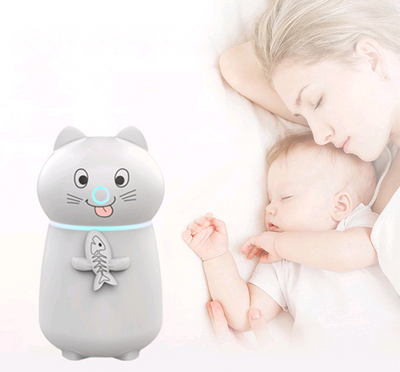 White cartoon cat humidifier with a pink tongue, black eyes, and whiskers, holding a fish skeleton, with a glowing blue light band. - Image 3