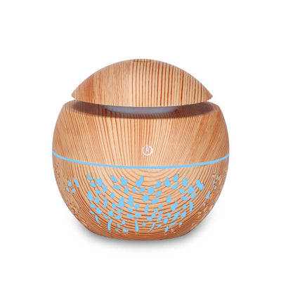 Dark wood grain mini ultrasonic humidifier with a mushroom shape and decorative hollow-out pattern. - Image 6