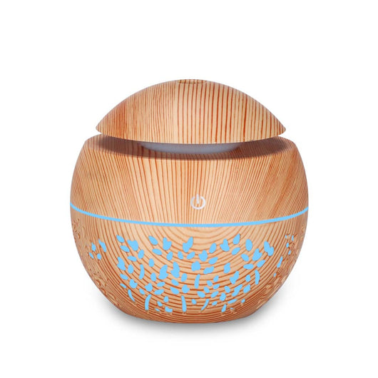 Dark wood grain mini ultrasonic humidifier with a mushroom shape and decorative hollow-out pattern. - Image 6