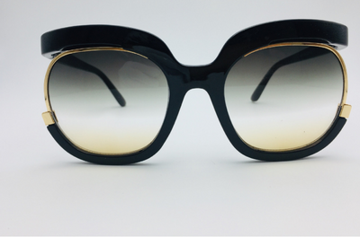 Black cat-eye half-frame sunglasses with gold accents and purple-grey gradient lenses, shown from front and side. - Image 20