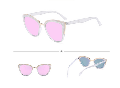 Female cat-eye sunglasses with clear marbled plastic frames, pink mirrored lenses, and gold-tone accents. - Image 2
