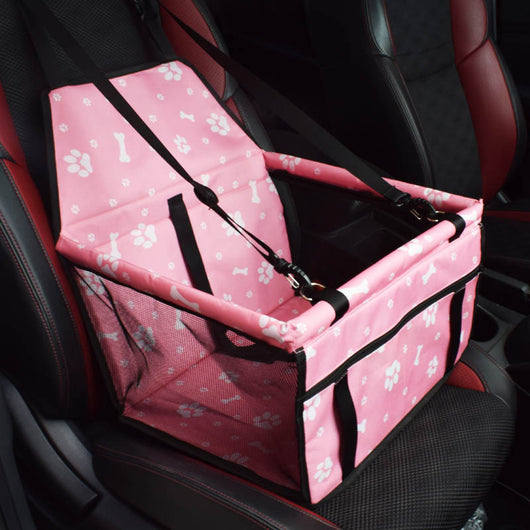 Light grey pet car booster seat with black mesh sides and adjustable straps, installed on a black and red car seat. - Image 16