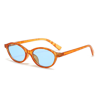Retro fashion small frame sunglasses with translucent brown frames and yellow oval lenses, viewed from an angle. - Image 7