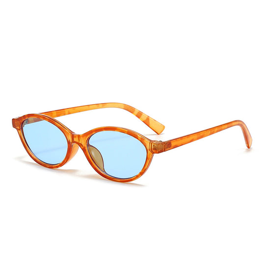 Retro fashion small frame sunglasses with translucent brown frames and yellow oval lenses, viewed from an angle. - Image 7
