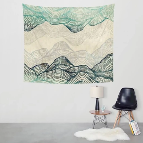 Dreamland Mountains Tapestry with abstract teal and grey wavy lines depicting a mountain landscape on a cream background.