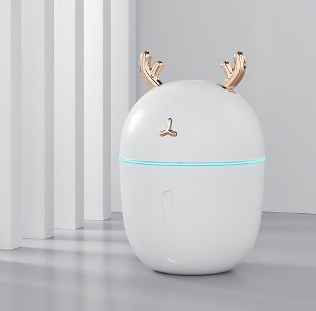 Pink deer-shaped mini humidifier with gold antlers and a glowing blue light band, on a pink background. - Image 12
