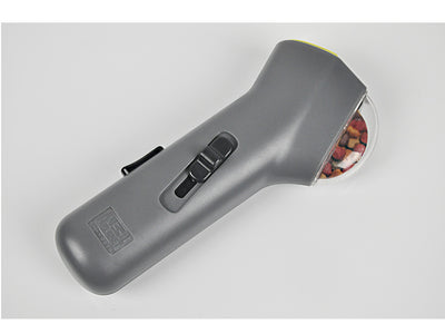 Dog Treat Launcher in retail packaging, a gray handheld device for dispensing snacks during training or playtime. - Image 11