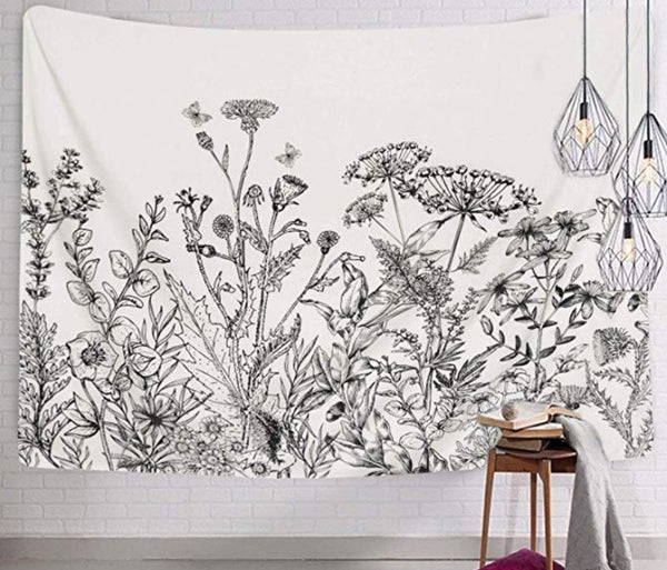 White tapestry with a black and white botanical print of wildflowers and butterflies, perfect for home decor.