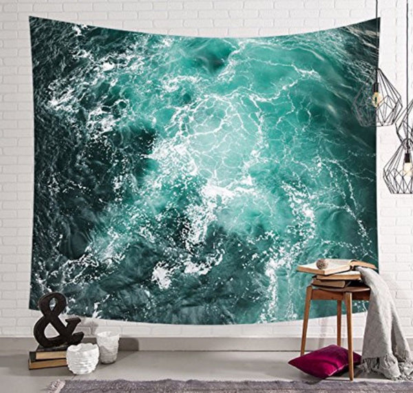 Sky and sea tapestry featuring a vibrant teal and dark blue ocean wave pattern with white foam.