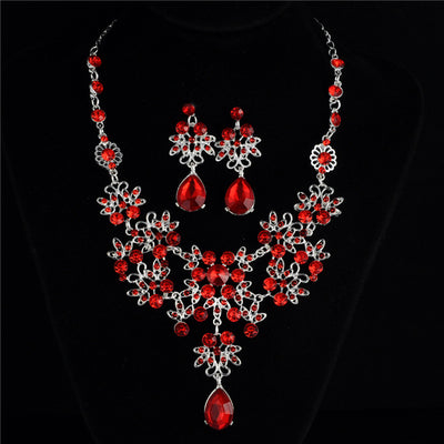 Silver-tone necklace and matching drop earrings set with clear rhinestones and teardrop crystals, ideal for weddings. - Image 13
