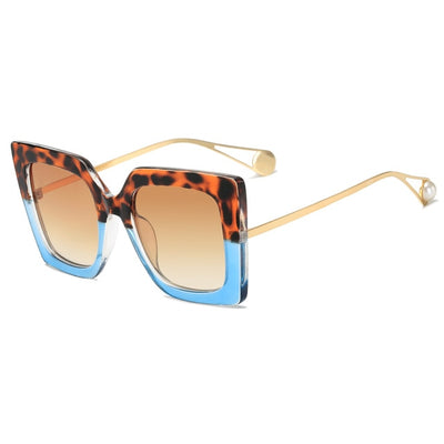 Women's black square frame sunglasses with blue gradient lenses and gold metal temples featuring a pearl accent. - Image 18