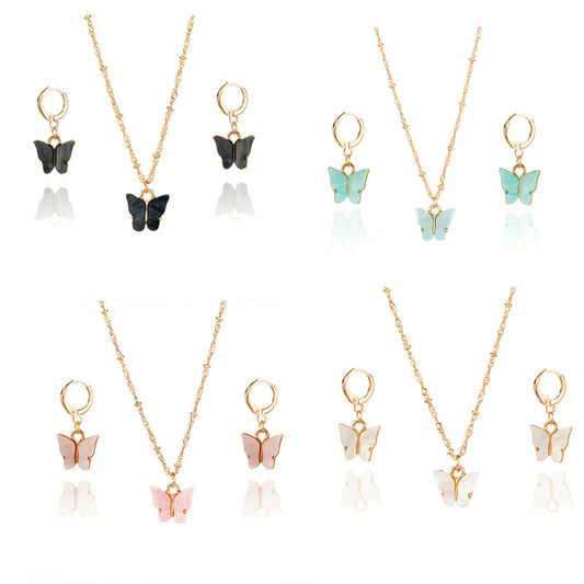 Pink acrylic butterfly necklace and earring set with gold-colored chain and hoop earrings. - Image 2