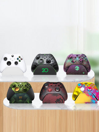 Black AOLION universal gamepad stand made of ABS plastic, designed to hold a game controller upright. - Image 2