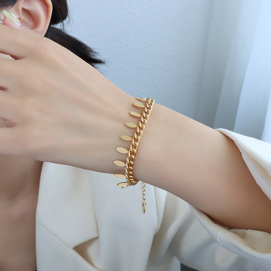 Pulsera de Cadena Elegante con Hoja y Borla