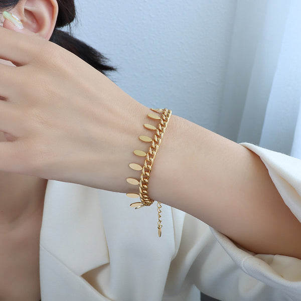 Pulsera de Cadena Elegante con Hoja y Borla
