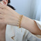 Pulsera de Cadena Elegante con Hoja y Borla