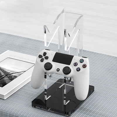 Black AOLION universal gamepad stand made of ABS plastic, designed to hold a game controller upright. - Image 14