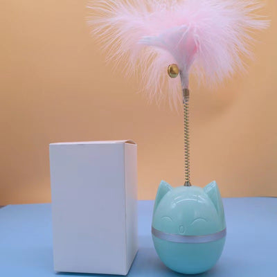 Pink cat-shaped tumbler toy with a feather attachment, featuring a cute face and silver band. - Image 6
