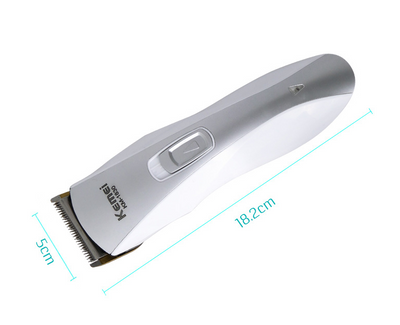 White and silver Kemei KM-1830 electric hair clipper with a charging base on a light background. - Image 2