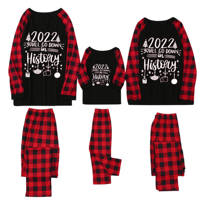 White long-sleeve pajama top with "wild one" graphic and red and black plaid pants. - Image 8