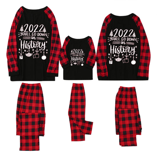 White long-sleeve pajama top with "wild one" graphic and red and black plaid pants. - Image 8