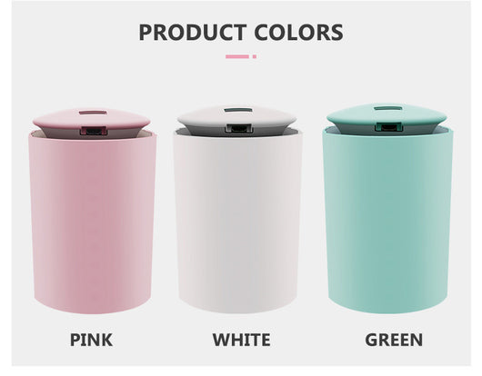 White cylindrical USB mini humidifier with blue LED light, emitting a fine mist, suitable for home or car. - Image 2