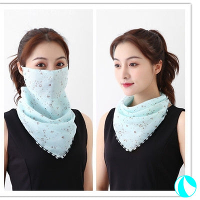 White women's UV protection scarf with black speckle pattern, worn as a face mask and neck scarf. - Image 11