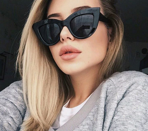 White and black cat eye sunglasses with gradient lenses, featuring a retro style. - Image 4