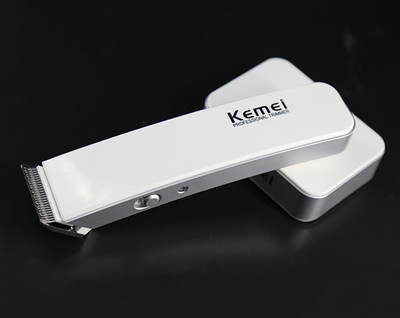 White and silver Kemei Professional Trimmer electric hair clipper with charging base. - Image 6