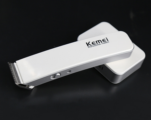 White and silver Kemei Professional Trimmer electric hair clipper with charging base. - Image 6