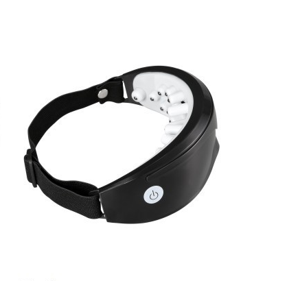White and black eye massager with a goggle-like design, featuring a white frame and dark lenses, on a wooden surface. - Image 10