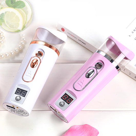 White and rose gold nano spray water meter with a clear tank, digital display, and power button. - Image 5