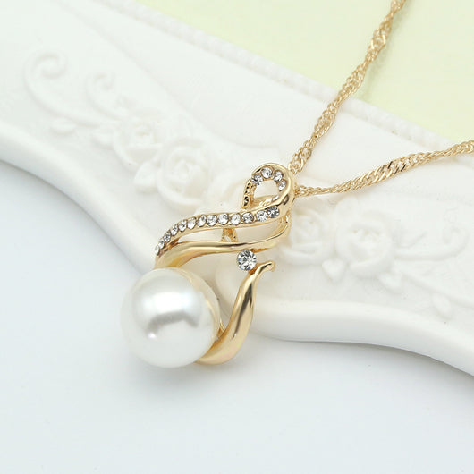 Gold-tone necklace and matching earrings set with white faux pearls and clear rhinestones, ideal for bridal or dinner wear. - Image 5