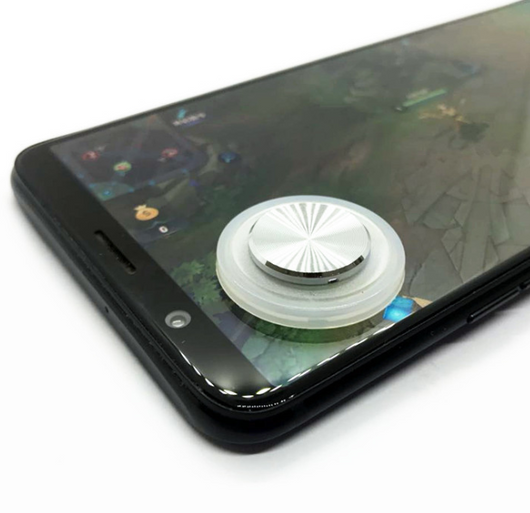Pink and silver mobile game joystick attached to a black smartphone displaying a game on its screen. - Image 12
