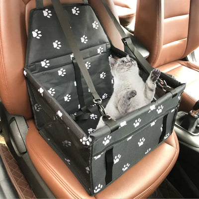 Light grey pet car booster seat with black mesh sides and adjustable straps, installed on a black and red car seat. - Image 33