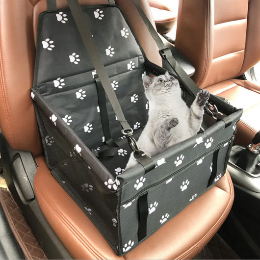 Light grey pet car booster seat with black mesh sides and adjustable straps, installed on a black and red car seat. - Image 33