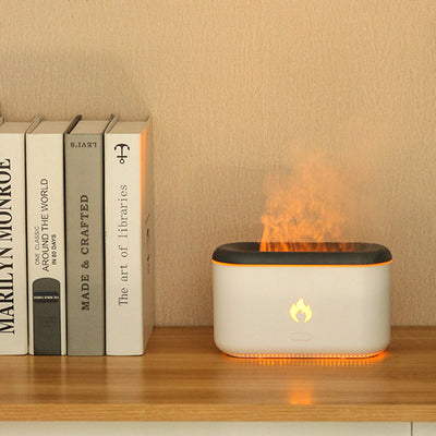 Dark gray rectangular ultrasonic aroma diffuser with rounded corners and a flame icon on the front, featuring an open top.