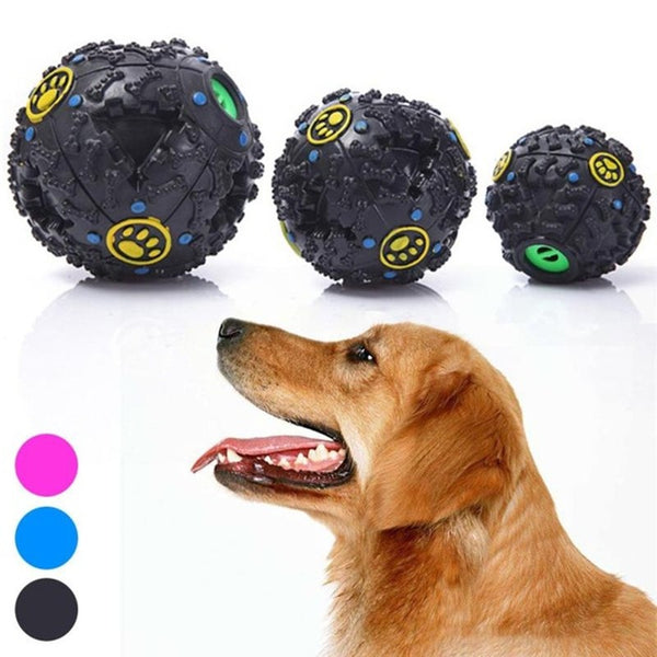 Black treat-dispensing dog toy ball with textured bone shapes, blue dots, and a yellow paw print logo.