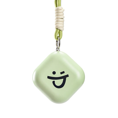 Light green square hand warmer with rounded corners and a black smiley face, hanging from a two-tone lanyard. - Image 7