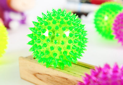 Four glowing sea urchin balls in neon pink, green, and yellow, with soft rubber spikes, for pets. - Image 3