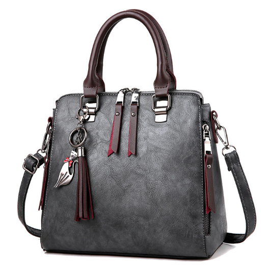 Bolso Elegante de Cuero con Dije de Gato y Borla - Image 5