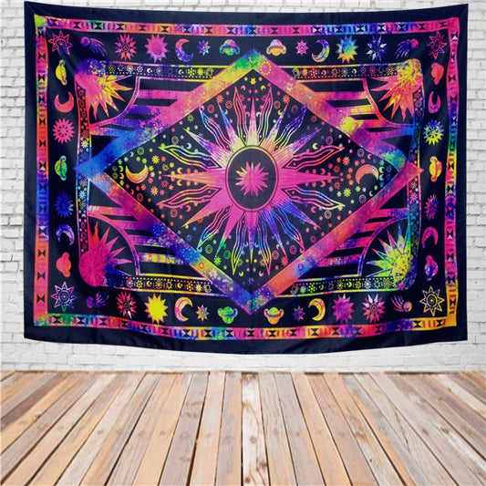 Vibrant psychedelic tapestry with a central sun, moons, and stars in neon pink, blue, yellow, and green.