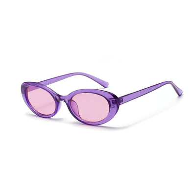 Translucent blue small frame oval sunglasses with light blue lenses on a white background. - Image 17