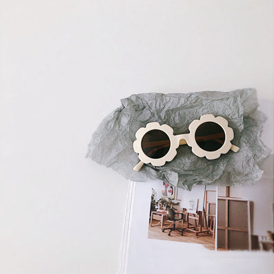 Orange flower-shaped sunglasses for babies and toddlers with dark lenses and a plastic frame. - Image 2