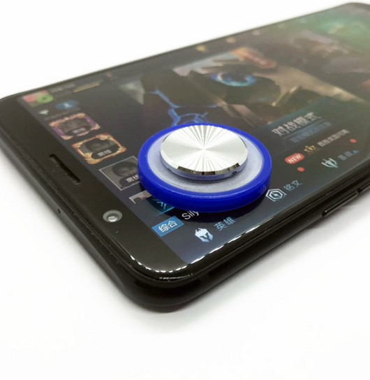 Pink and silver mobile game joystick attached to a black smartphone displaying a game on its screen. - Image 10