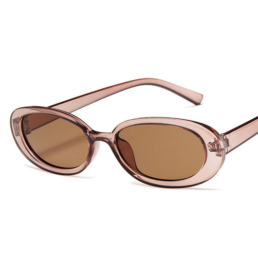 Small frame oval sunglasses with a tortoiseshell pattern and brown lenses on a white background. - Image 8