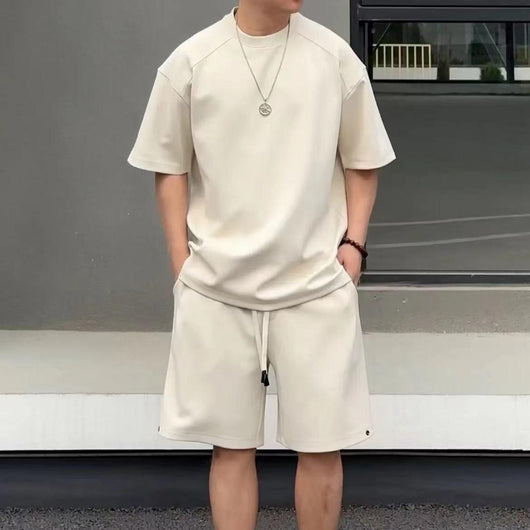 Khaki men's short-sleeved t-shirt and matching shorts set, featuring a loose fit and white drawstring.