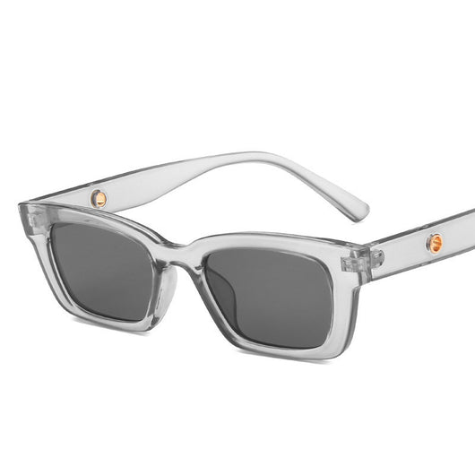 Transparent gray frame sunglasses with dark gray rectangular lenses and small gold accents on the temples. - Image 19