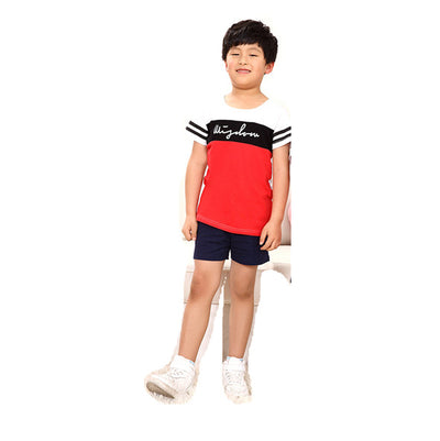 Young girl in a white short-sleeve t-shirt with a black stripe and black shorts, wearing a black cap. - Image 11